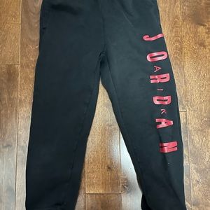 Boys black and red Jordan jogging pants.